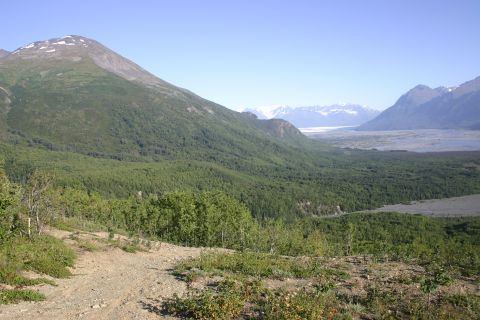 2003 Jeep TJ - Expansive mountain scenery with a valley and distant snow-covered peaks.