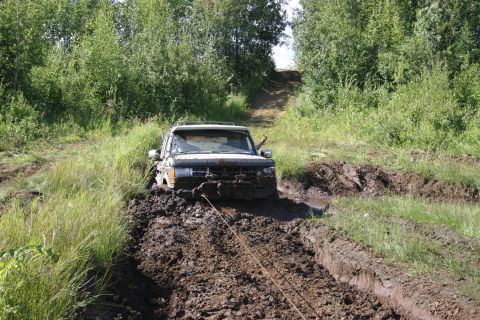 2003 Jeep TJ - Vehicle stuck in mud during an off-road excursion.