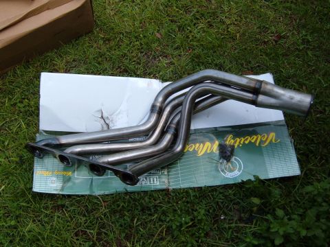 1978 Ford Bronco - Exhaust headers are shown laid out on a box with "Velocity Wheel" text visible.