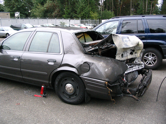 Side of the Trooper's slick-top. This unit has had the 2003 recall "fix" from Ford which takes care of the rear end collision fire problem.  The trooper and was in the driver's seat and a subject was in the back seat when the collision happened and the fire started. The trooper, although injured, rescued the prisoner and both survived. This was the second rear-end collision from drunks in a two week period for the state. The first driver was not caught. The moron in this one was.