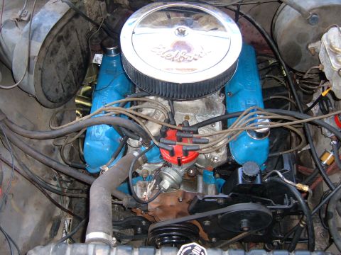 1978 Ford Bronco - The engine bay shows a Ford V8 with blue valve covers and a prominent air filter assembly.