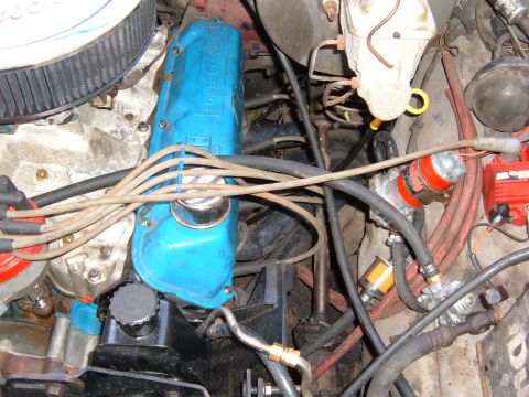 1978 Ford Bronco - The engine bay features blue valve covers with 'POWER BY FORD' lettering, indicating a Ford engine, but the specific vehicle year cannot be…