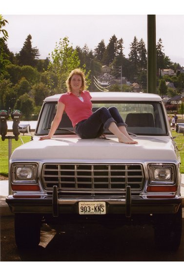 1979 Ford Bronco - Woman poses on the hood of a 1979 Ford Bronco. The truck has a Washington state license plate.