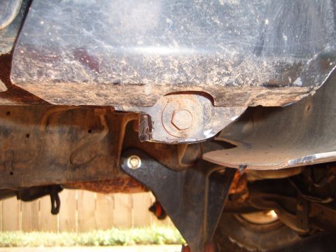 1988 Ford Bronco - Close-up view of the undercarriage, focusing on the frame and suspension mounting points.