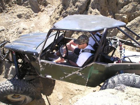 1989 Ford Bronco - This heavily modified off-road buggy is designed for extreme terrain, with a reinforced roll cage and large, aggressive tires.