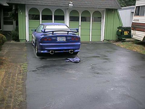 1993 Ford Probe - Rear view of a blue 1993 Ford Probe parked in a driveway.