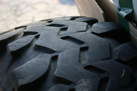 2003 Jeep TJ - The aggressive tread pattern on this tire is visible in close-up detail.