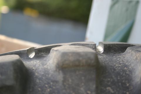 2003 Jeep TJ - The deep tread pattern of a heavy-duty tire is shown in detail.