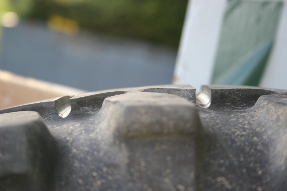 Close-up of a large tire tread with deep grooves