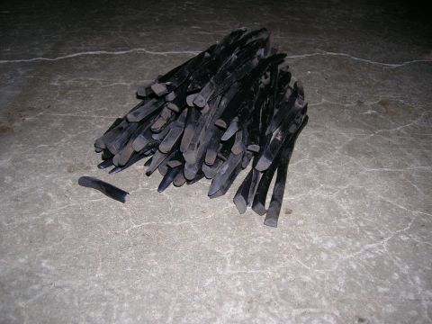 2003 Jeep TJ - A collection of tire levers, likely used for changing tires, rests on a concrete surface.