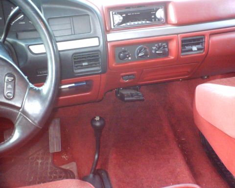 1989 Ford Bronco - Interior view of a 1989 Ford Bronco, the dashboard, steering wheel, and floor shifter.