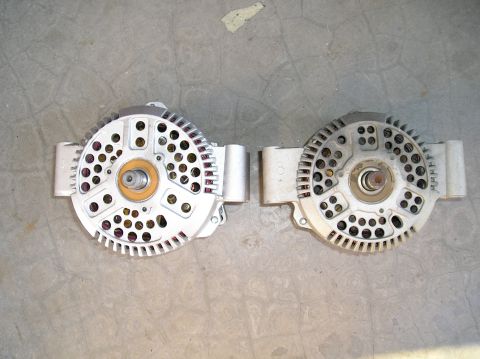 1993 Ford Bronco - Two alternators are shown, possibly for comparison or replacement. One appears slightly larger than the other.