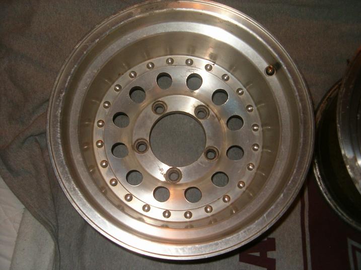 Aluminum alloy wheel with multiple bolt holes and a central hub opening