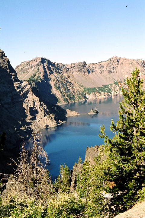 1979 Ford Bronco - A scenic view of Crater Lake, Oregon, with its distinctive blue water and surrounding mountains.