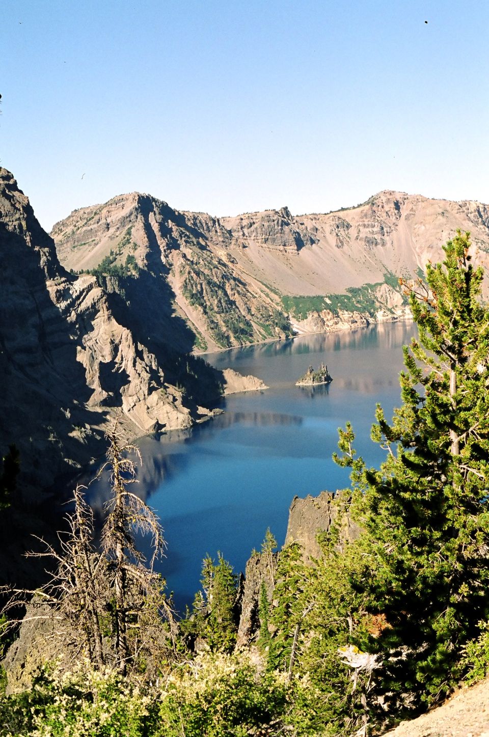 Crater Lake landscape with mountains and blue water