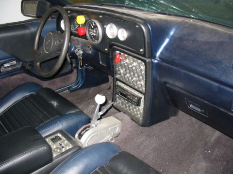 1987 Ford Thunderbird - The interior of a 1987 Ford Thunderbird shows custom modifications to the dashboard and shifter console.