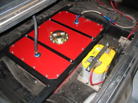 1987 Ford Thunderbird - A custom fuel cell and battery setup is visible inside a vehicle's cabin.