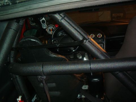 1995 Ford Probe - Interior of a 1995 Ford Probe, modified with a roll cage and racing seats.