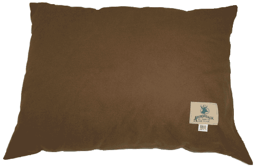 Brown pillow with a white tag showing text and a logo