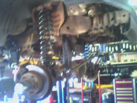 1993 Ford Bronco - Underbody view of a 1993 Ford Bronco showing suspension lift installation.