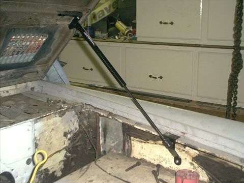 1990 Ford Bronco - Gas strut installed on an open engine bay.