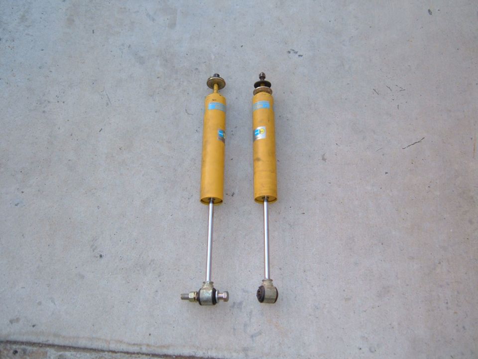 Pair of yellow Bilstein shock absorbers with blue labels