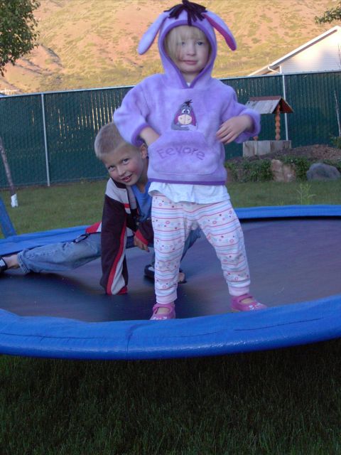 1992 Ford F-150 - Two children enjoy a day on a trampoline, with one dressed in a purple Eeyore costume.