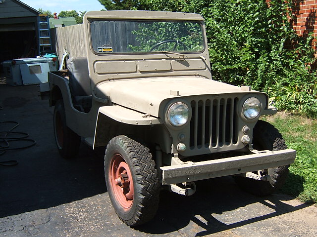 Tan 1950 Jeep Willys 3/4 front view
