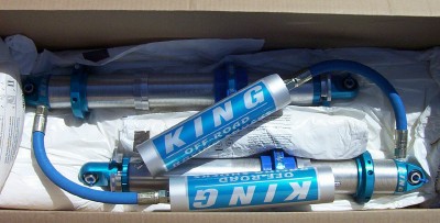 1995 Ford Bronco - Several King Off-Road shock absorbers are packaged inside a cardboard box.