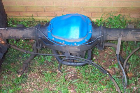 1987 Ford Bronco - Rear axle assembly, likely from a Ford truck or SUV, with a blue painted differential cover.