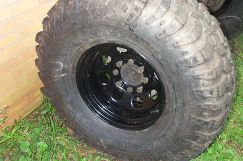 1987 Ford Bronco - This is a close-up view of a single off-road tire and rim, not a 1987 Ford Bronco.