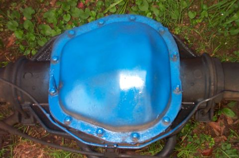 1987 Ford Bronco - Rear axle differential cover painted bright blue, shown outdoors.