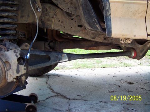 1987 Ford Bronco - Close-up view of a vehicle's suspension system, showing modified components and a date stamp of 08/19/2005.