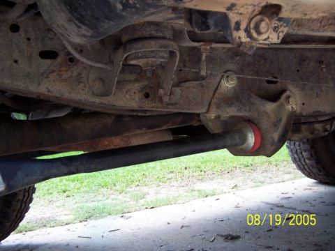 1987 Ford Bronco - Undercarriage view of a 1987 Ford Bronco, highlighting suspension parts and frame.