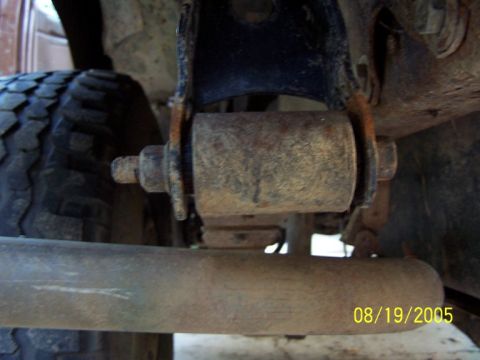 1987 Ford Bronco - A close-up view of a rusty suspension bushing and bolt, with a date stamp of 08/19/2005.