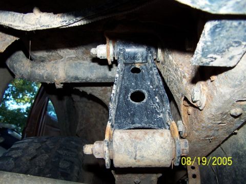 1987 Ford Bronco - Underbody view of a vehicle's suspension component, likely a lift kit part.