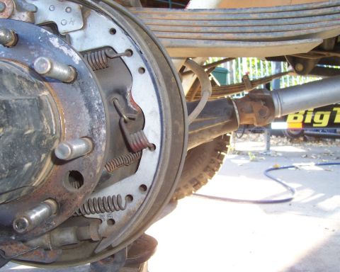 1994 Ford F-150 - The rear axle and suspension components of a vehicle are shown in this close-up view.