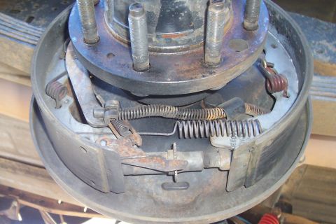 1994 Ford F-150 - Close-up view of a vehicle's rear drum brake assembly, highlighting internal components and wear.