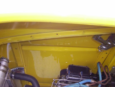 1995 Ford Bronco - A close-up view of a vehicle's engine bay, showing various mechanical parts.