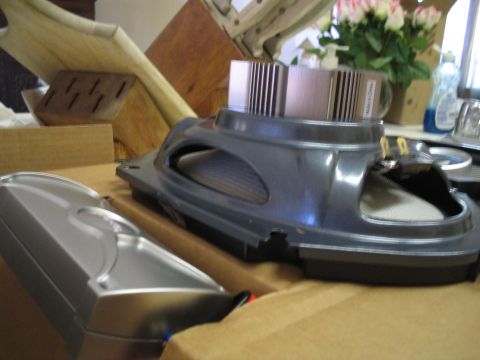1993 Ford Probe - Car speaker with silver heatsink on top, part of a larger assembly.
