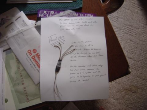 1998 Ford Taurus - Instructions and a wiring diagram are shown on a piece of paper, next to some mail.