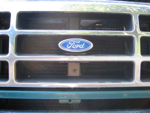 1996 Ford Bronco - little screw here in addition to the four on top, easy to miss. I happened about it while looking at my trans fluid cooler.