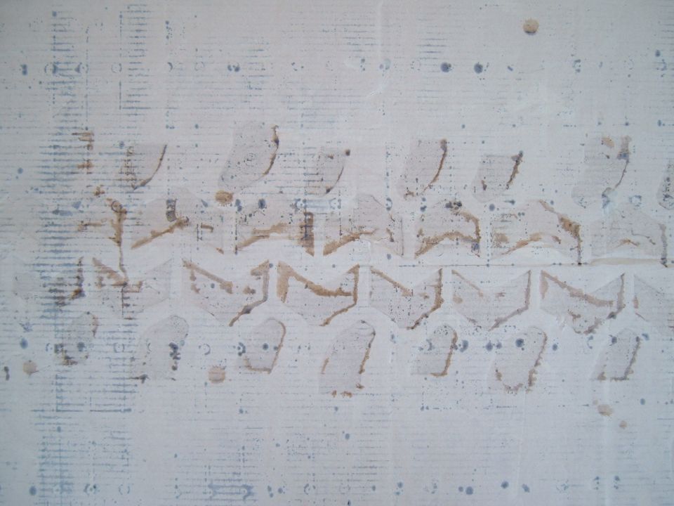 Tire tread impression on a white surface