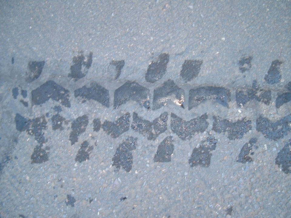 Tire tread impression on asphalt