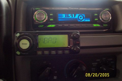 1995 Ford F-350 - The interior dashboard features a Pioneer radio and a CB radio displaying 'ROAD', along with climate controls.