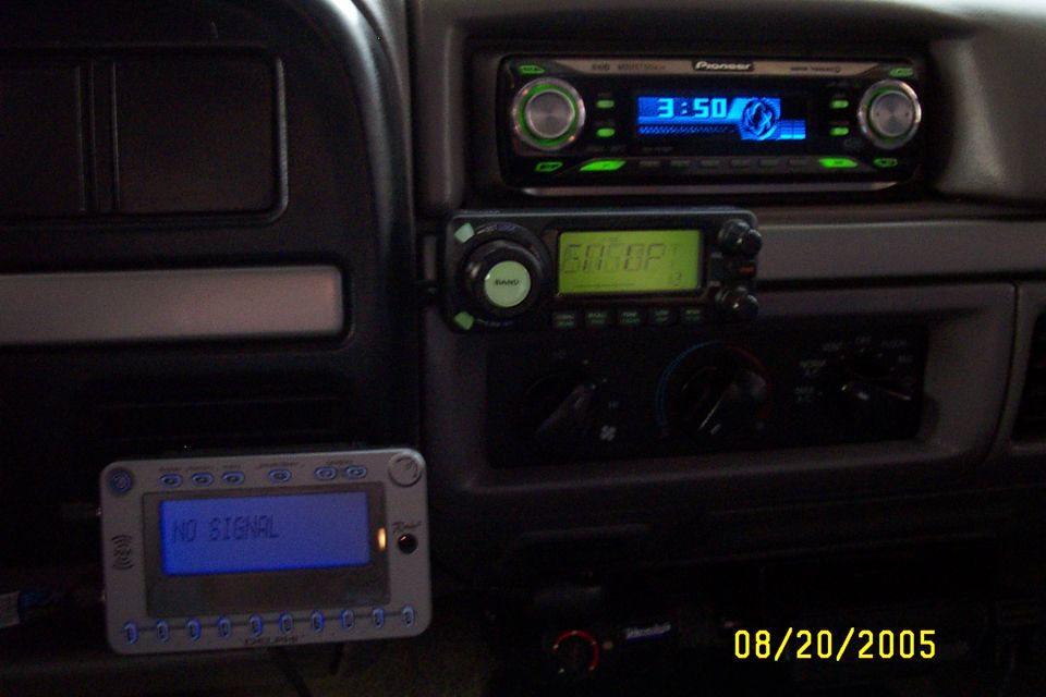 Vehicle interior showing a Pioneer stereo, a CB radio, and a "NO SIGNAL" display unit