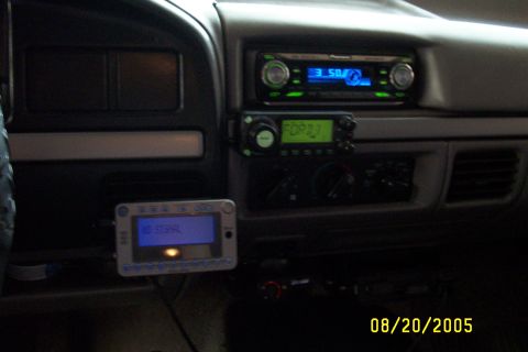 1995 Ford F-350 - The interior of a truck shows a dashboard with multiple electronic devices installed.