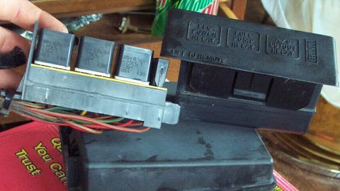 1985 Ford Crown Victoria LTD - Close-up of an electrical relay box, showing multiple relays and text labels.