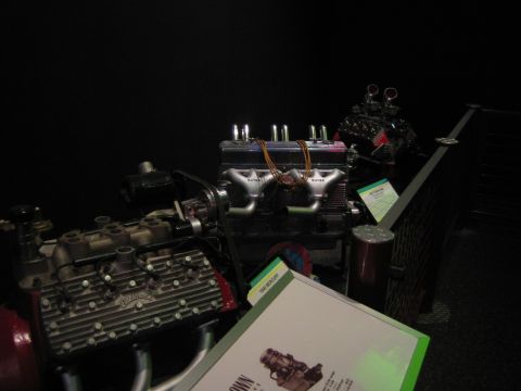1968 Ford Mustang - Display of vintage engines, possibly at a museum exhibit.