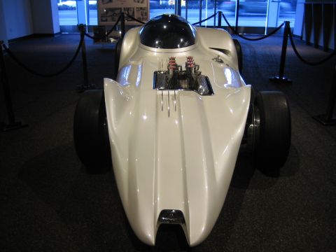 1968 Ford Mustang - Custom streamliner concept car with exposed V8 engine and bubble canopy on display.
